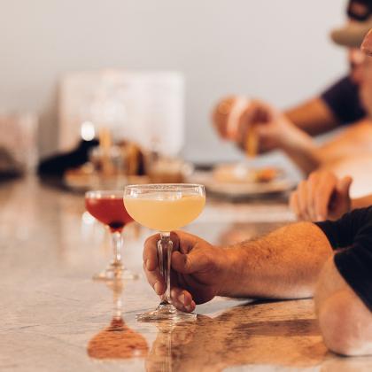 men enjoying drinks at the bar 