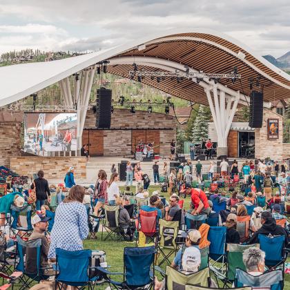 people enjoying a concert at bandshell 