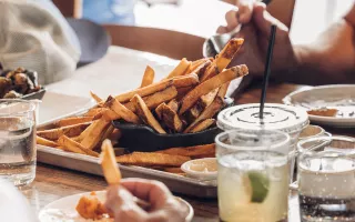 fries drinks on a table 