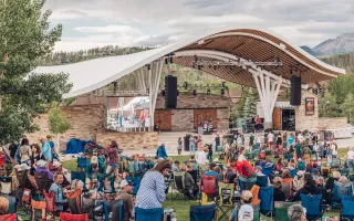 Image of the Rendezvous Event Center Stage with a crowd of people enjoying the free, live music