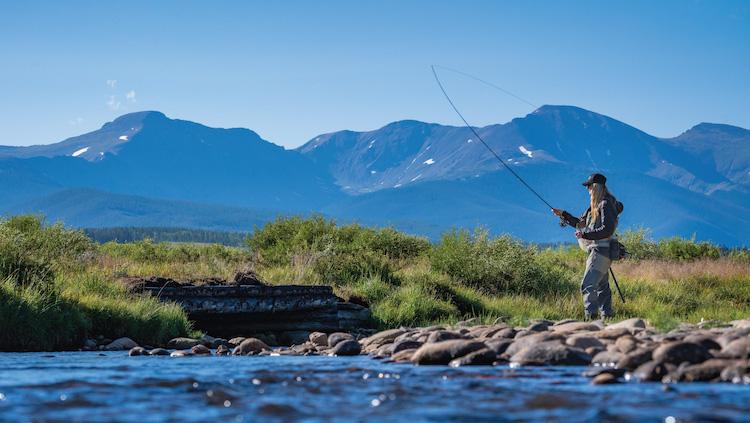 Woman fly fishing in the Colorado River