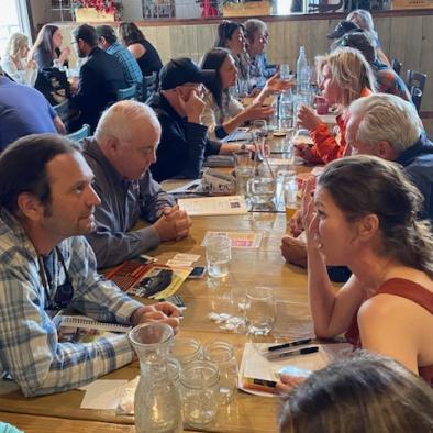 people sitting at a table enjoying lunch 