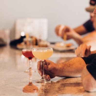 men enjoying drinks at the bar