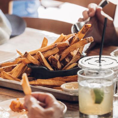 fries drinks on a table 