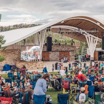 Image of the Rendezvous Event Center Stage with a crowd of people enjoying the free, live music
