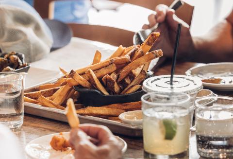 fries drinks on a table 