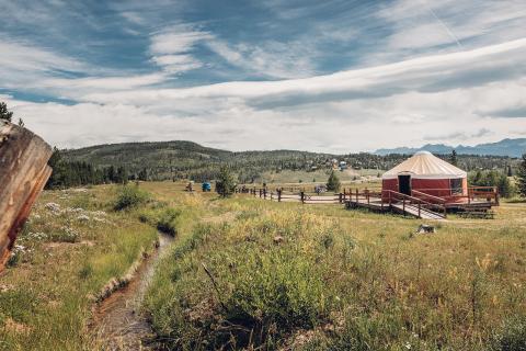 yurt with a mountain background