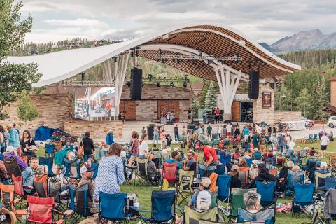 people enjoying a concert at bandshell 