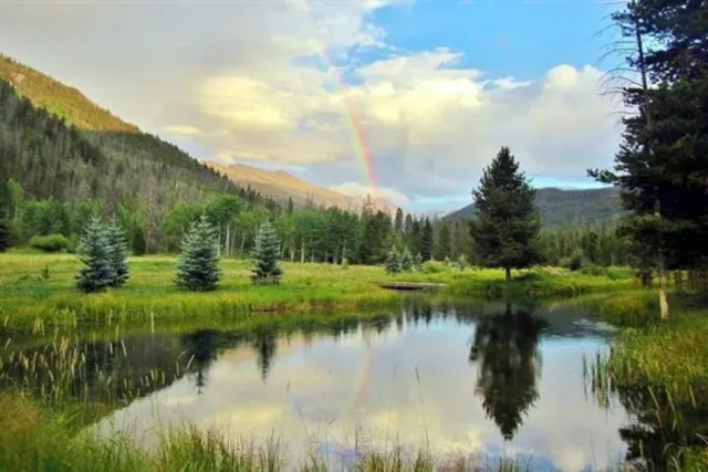 Little Indian Lake, our private lake at Arapaho Valley Ranch Photo 3