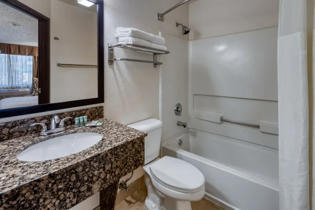 Standard bath pictured - we have ADA compliant bathrooms and a roll in shower by request Photo 4
