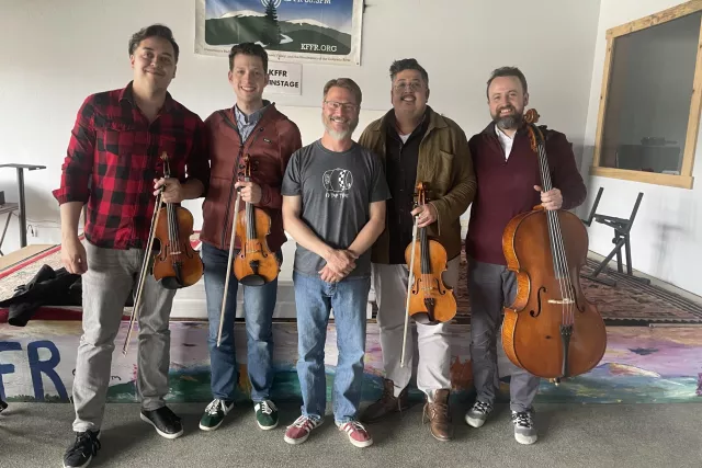 DJ interviews a string quartet playing in the Grand Concert Series Photo 3