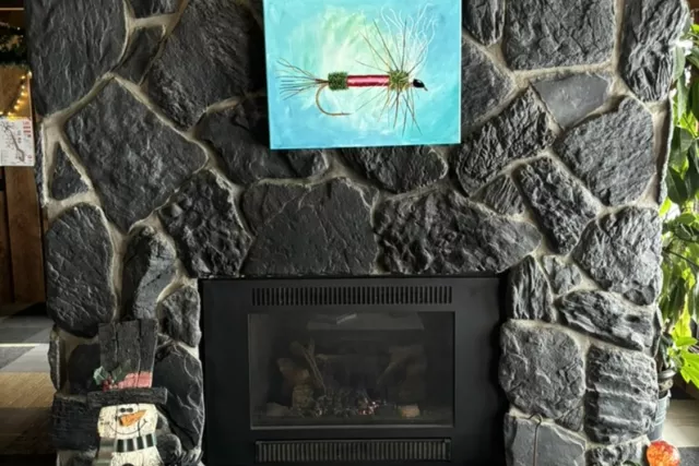 Our cozy lobby fireplace, decorated with LOCAL art! Photo 9