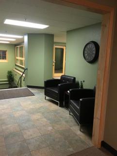 Seating in lobby closest to parking lot in back.