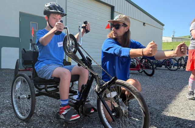 Teaching a participant how to use the hand controls on the bike