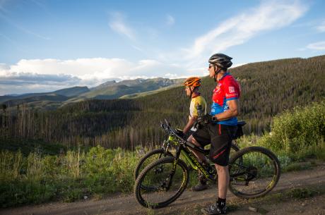 Bikers enjoying a scenic view of Winter Park and the Fraser Valley during a ride